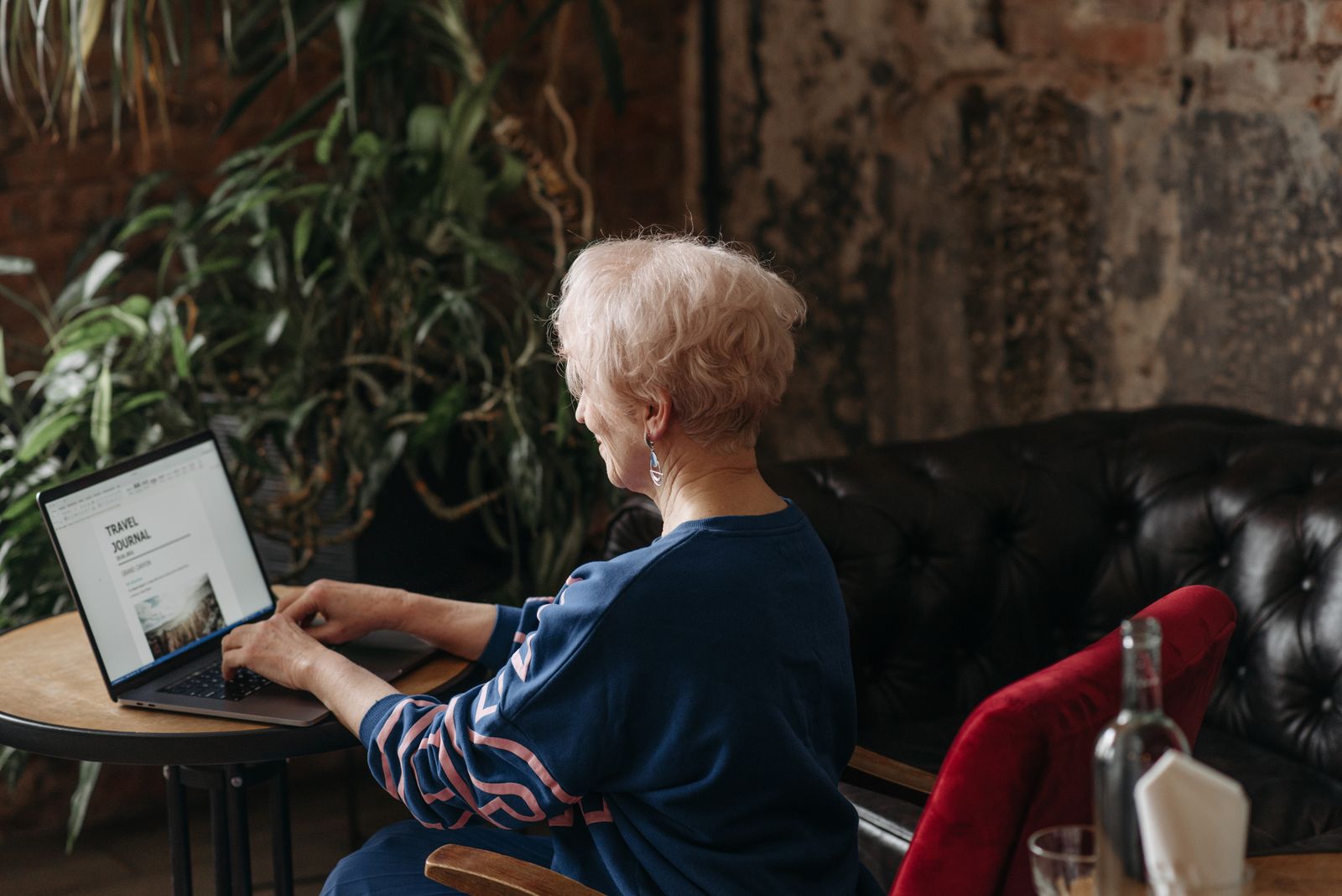 Senior woman learning digital skills on a laptop